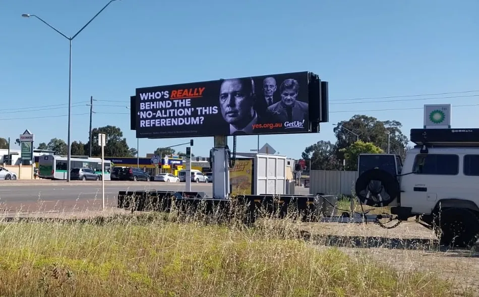 Roadside trailer-mounted LED billboard displaying a referendum campaign advertisement