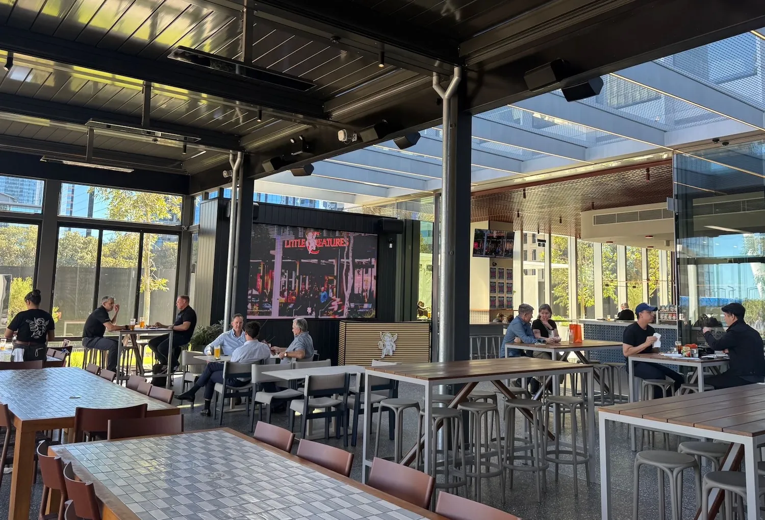 Indoor LED screen displaying a Little Creatures advertisement inside a bar at Elizabeth Quay